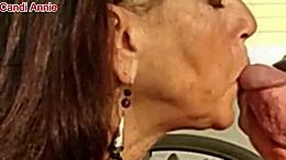 Close up of a mature woman's face while she gives a blowjob and swallows cum