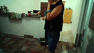 Stella Still shows off her big tits in the kitchen