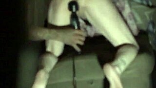 Daynish, a hairless milf, indulges in solo masturbation with her shaved body glistening under the light.