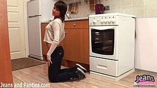 Emo girl with short hair teases in tight blue jeans