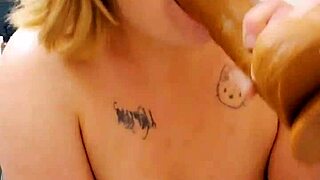 Squirting milf fucks herself with giant cock toy