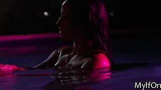 the brunette milf enjoys a big black cock titty fuck in the pool under the night sky