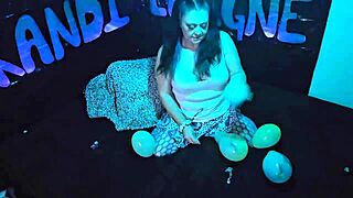 Cute milf Kandi Laigne demonstrates balloon popping fetish.