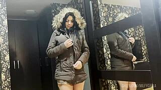 In a steamy encounter, a busty MILFy mom covers her plump figure with cum on a brown fur lined puffer jacket