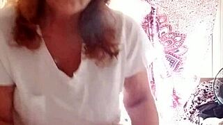 Mature woman moisturizes her attractive body