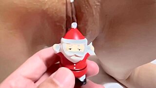 Santa Claus intriguingly plays with wet shaved pussy using dildo.