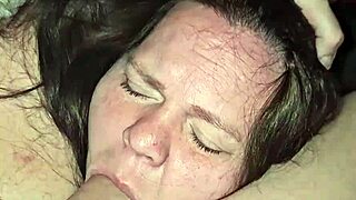 A mature woman gives a deep throat job and breast play