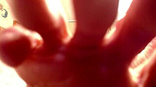 A mature amateur with big tits and a big ass shows her beaver while smoking a cigarette