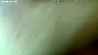 A bald, curvaceous woman experiences an orgasm while being stimulated