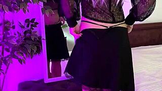 Beautiful woman in her prime, wearing sexy garter and glasses