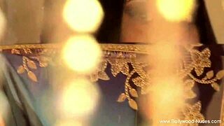 An erotic Indian woman performs an exotic dance, feeling the moments