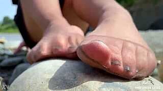 Ever seen a goddess tease with nylon soles by the riverside?