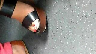 mature feet captured candidly in wedges sandals