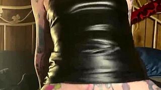 A hot MILF, covered in ink, rides a dildo until orgasm