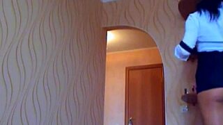 A beautiful girl in a cam show wears only a skirt and teases her tits