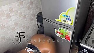 hot milf camgirl rides 14-inch dildo on fridge in kitchen video