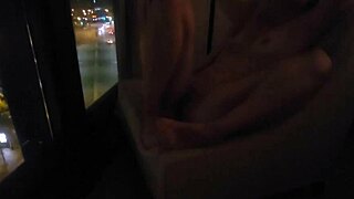Petite babe masturbates in public by hotel window for thrill