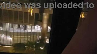 Petite babe masturbates in public by hotel window for thrill