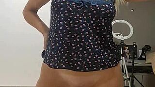 blonde milf aline fingers her shaved pussy in homemade video.