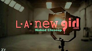 The enchanting brunette beauty displays her sexy body on the sofa.