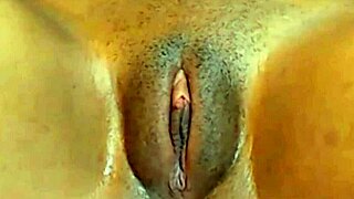 Cute Jamaican girl rubs her fat cameltoe pussy for fun.