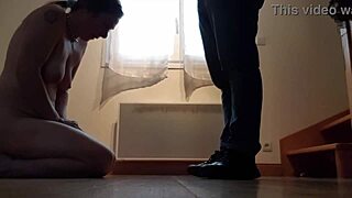 Bound slut poses with collar in humiliating session