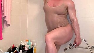 Muscle mommy teases with wet curves in steamy shower scene
