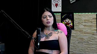 Stunning Tattooed Brunette Flashes Huge Boobs in Daring Game