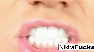 nikita sticks a toy deep inside her wet pussy