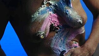 Messy birthday cake girl plays with food on natural tits