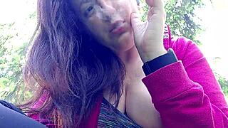 i'm nicoletta smoking in a public garden flashing my big tits outdoors
