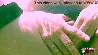 Penny Pax performs an underwater striptease and teases seductively