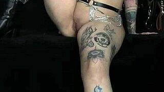 Bastet shows tattooed tits in bold fetish video