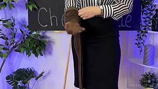 sexy mature woman in sheer brown pantyhose teasing in nylon club.