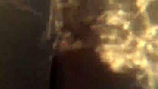 Woman surprised while relaxing in the pool water