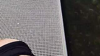 Couple risks getting caught fucking outdoors at the lake. They expose big natural tits and perform blowjob for anyone to watch.