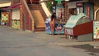 this milf is strolling nude in public, flashing passersby like a naughty exhibitionist