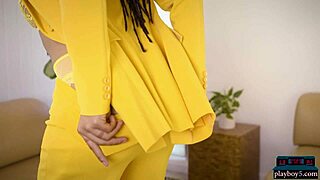 Curvy black milf beauty Kira Noir does a striptease out of her business outfit