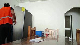 Maintenance Man Checks Refrigerator While Housewife Shows Vagina On Table