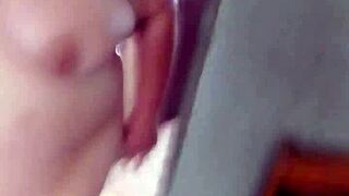 Chubby milf plays with big pussy in bathtub then sucks step son's cock deep. She rides him until cum covers her huge natural tits.