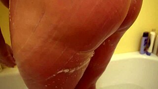 Tanned Russian milf shaves smooth pussy in bathroom then slips into stockings and heels for solo fingering masturbation
