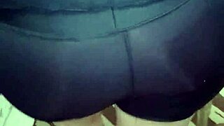 señora with big ass in shiny spandex leggings shows off her curves