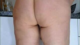 Hidden camera catches my stepmom in the kitchen wearing only panties and a see-through blouse - what a shocking taboo sight!