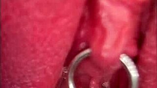Close-up shows my pissing shaved pussy with pierced clit in outdoor solo moment.