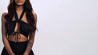 September Reign strokes her huge fake tits in passionate solo play