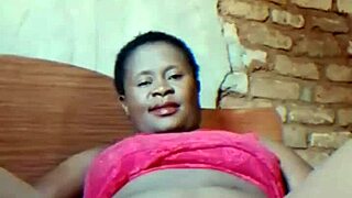 Hubby gone—watch this sexy African milf finger her dripping wet pussy teasingly!