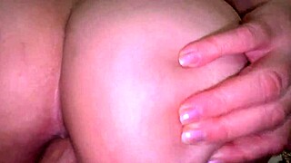 stepmom gazes at sunset as stepson sneaks up behind