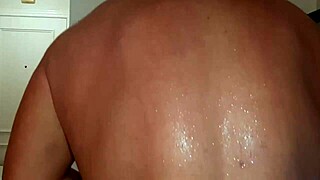oiled muscles flex while she squirts from huge cock pounding