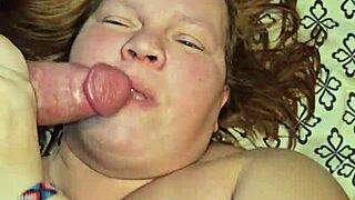 dirty milf sucks huge cock between her massive tits!